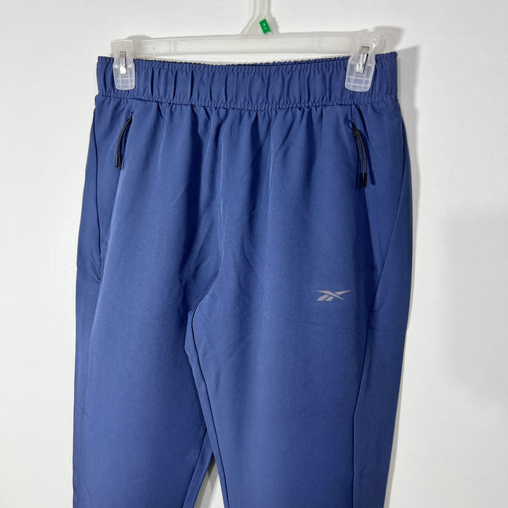 REEBOK HYBRID PARACHUTE SPORT TROUSER WITH SIDE ZIP POCKET BLUE COLOUR